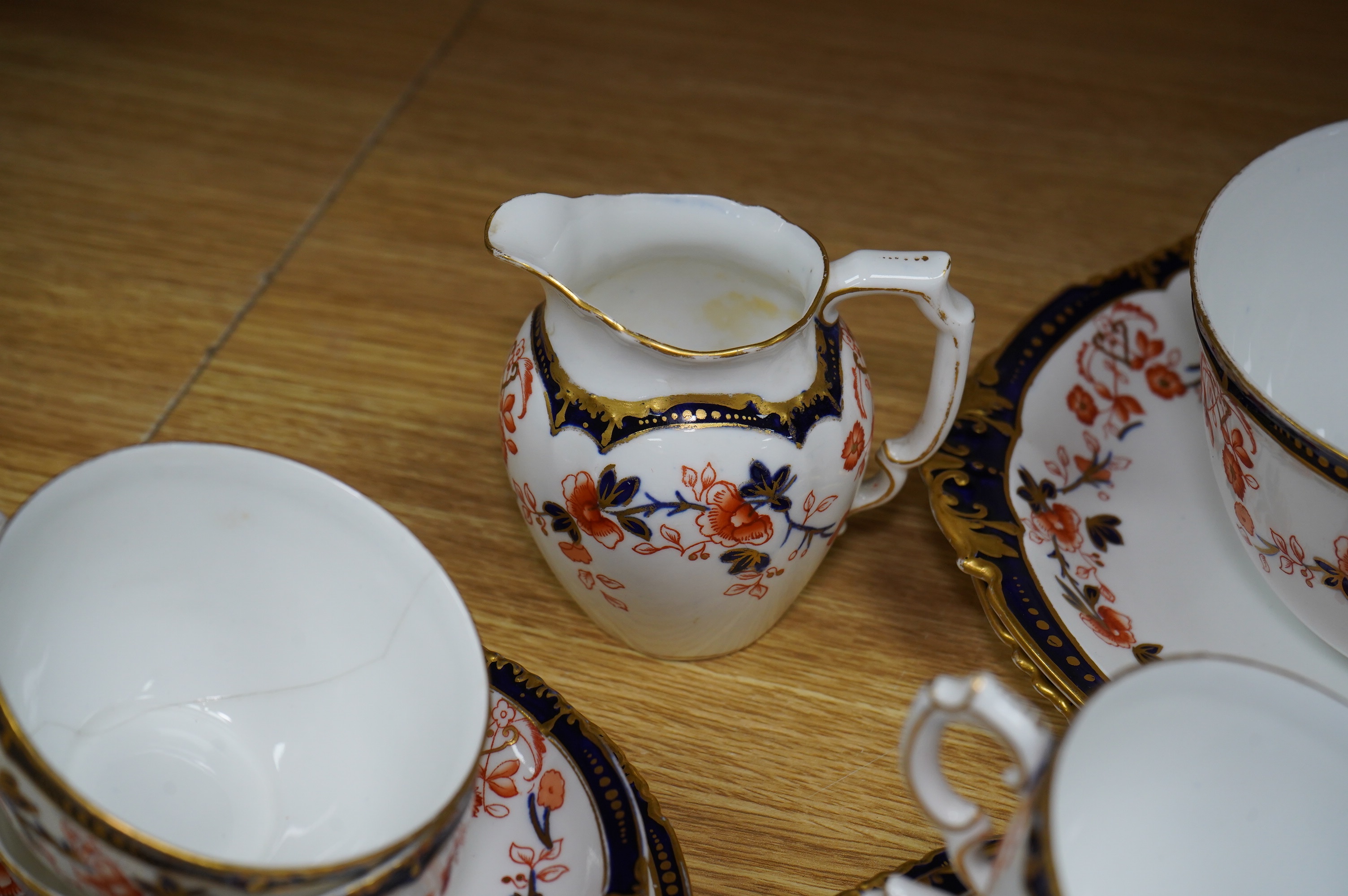 A Royal Crown Derby Imari porcelain part tea set to include sandwich plates, trios and milk jug. Condition - varies, some breaks